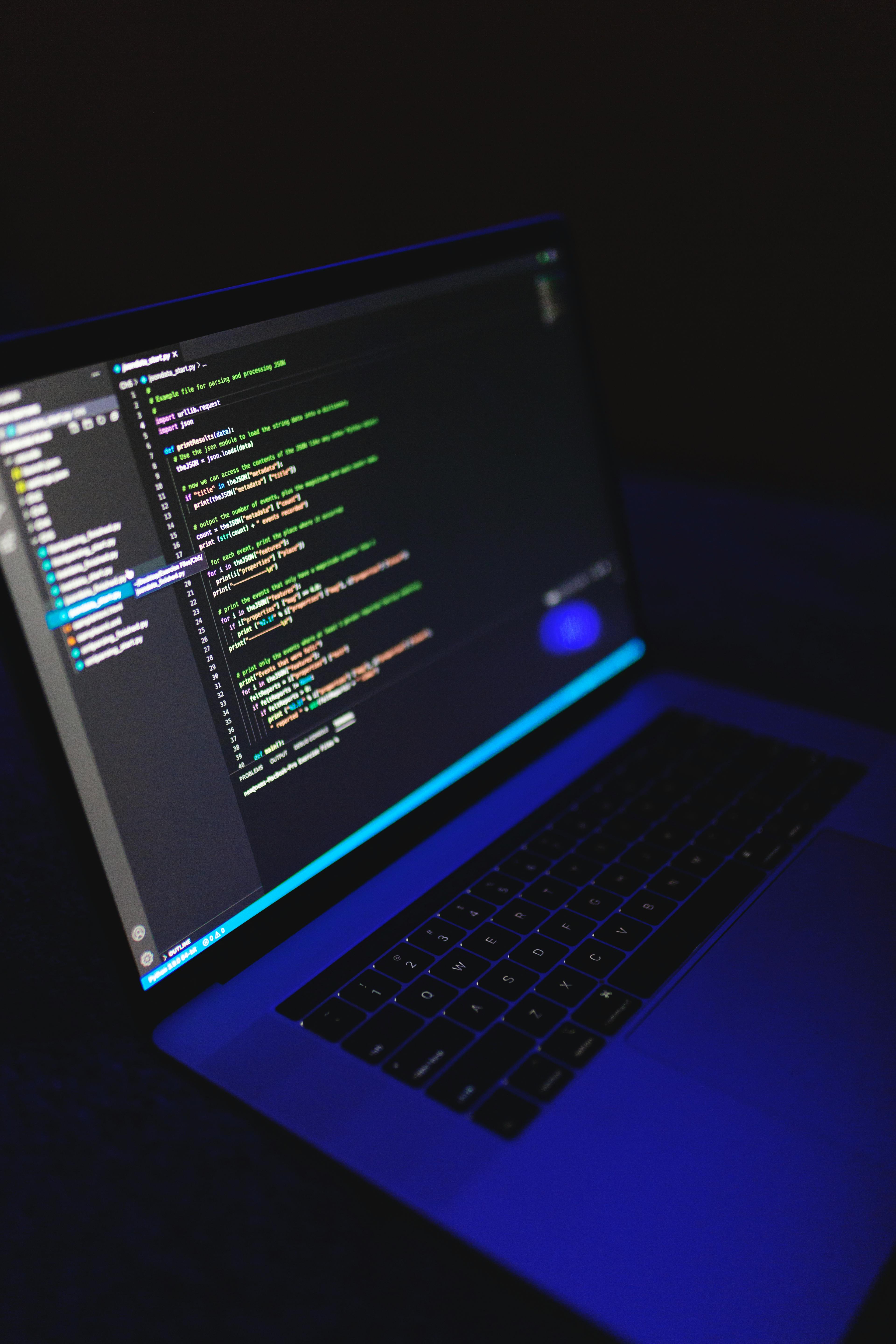 Programmer Coding on Laptop